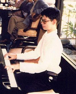 Young Tom at the piano